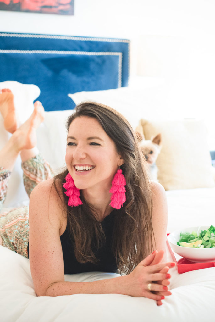 Isabel Smith Nutritionist with salad on the bed